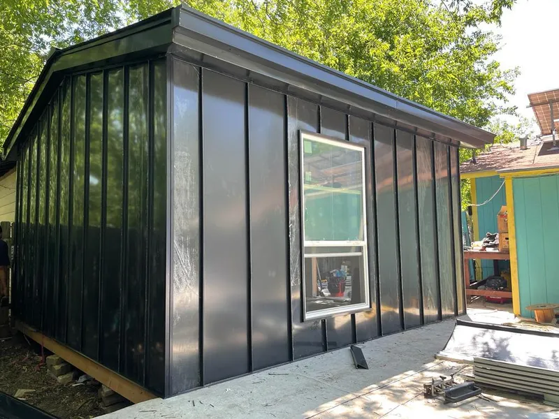 Black standing seam metal wall panels for Roof Inspection in Robinson